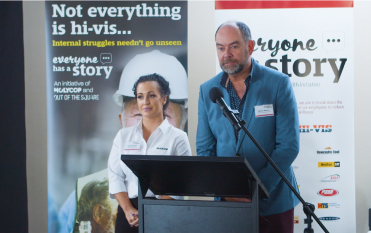 Person standing at lectern speaking